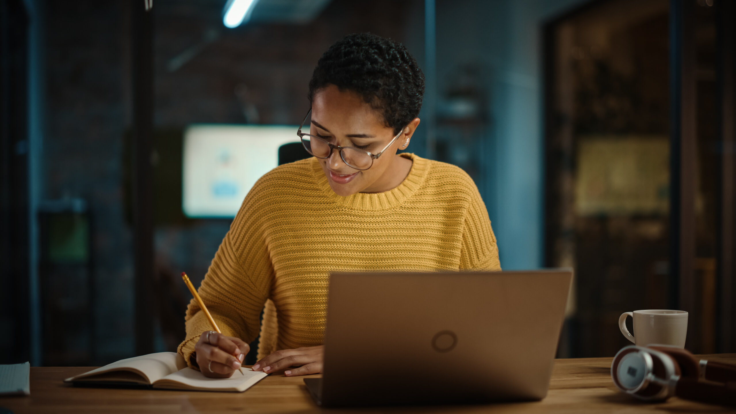 Young,Hispanic,Marketing,Specialist,Working,On,Laptop,Computer,In,Busy